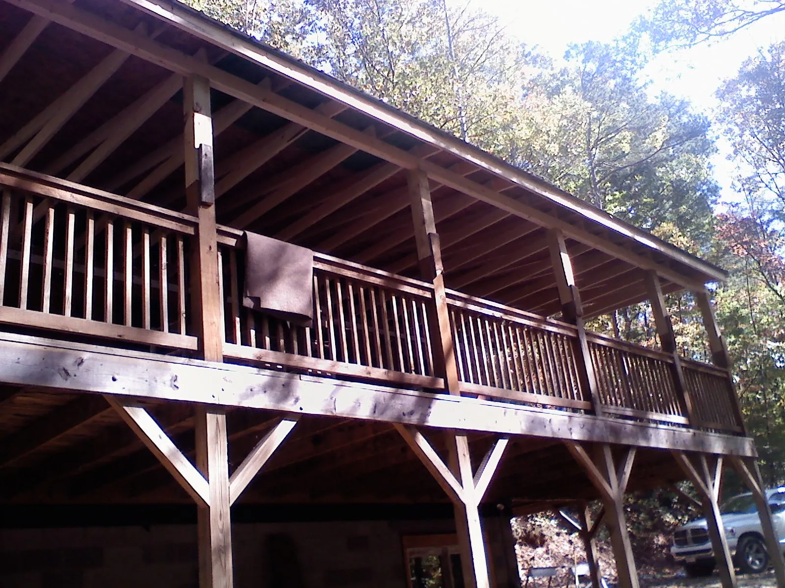 Timber framing under a new elevated porch and deck — Roof Leak Repair in West Sand Lake by Roofing Brothers